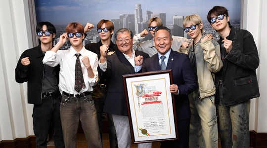 K-pop Band posing with Doane Liu and Councilmen John Lee.