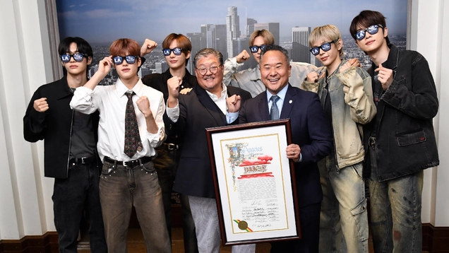 K-pop Band posing with Doane Liu and Councilmen John Lee.
